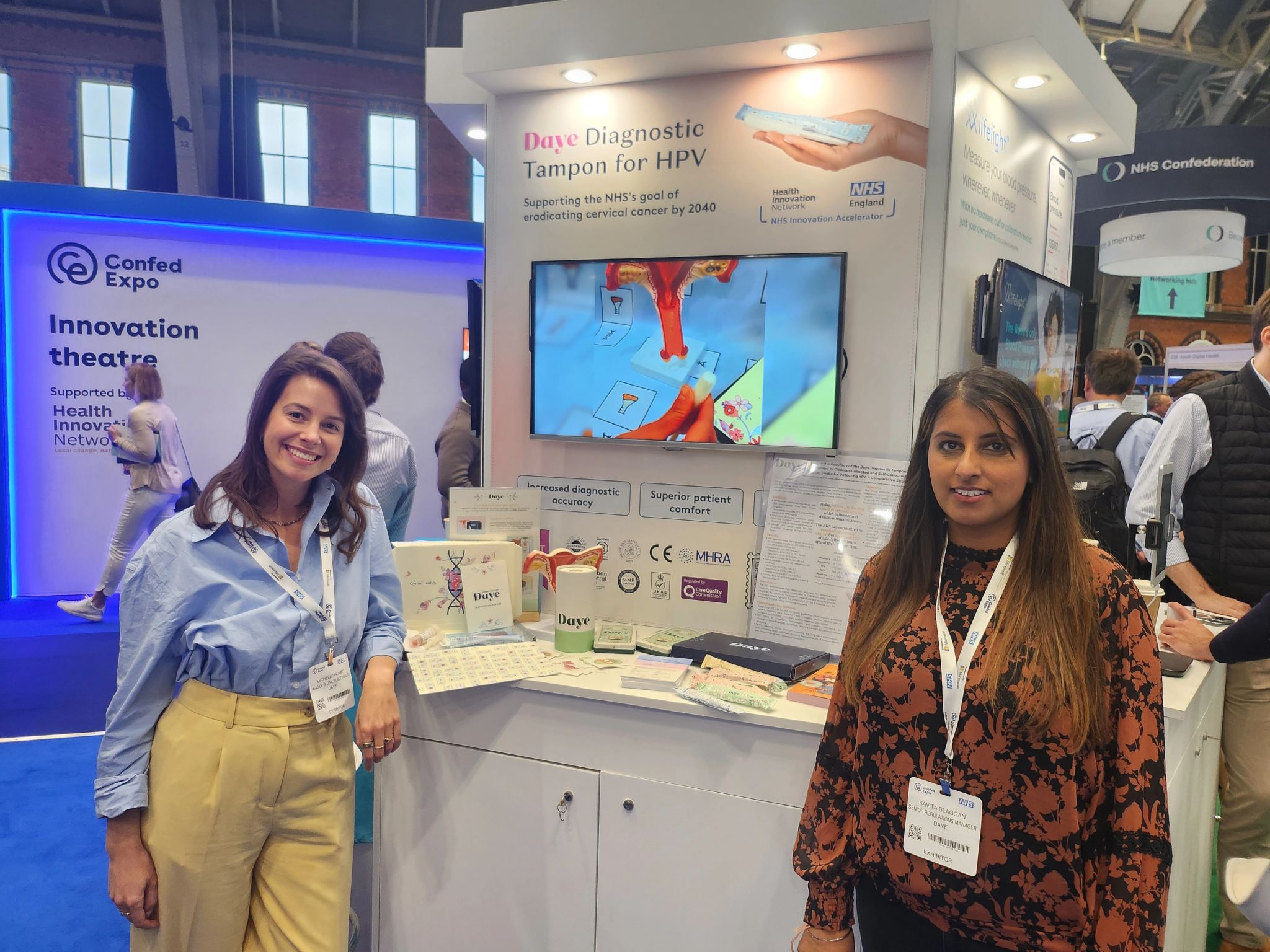 Two female innovators representing Daye diagnostic tampon at their stand at NHS Confed Expo in 2025